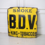 Vintage Enamel Advertising Sign – “SMOKE B.D.V. The King of Tobaccos”